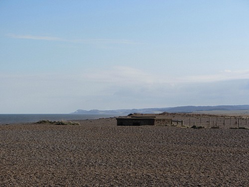 Cley beach with a half buried pill box!