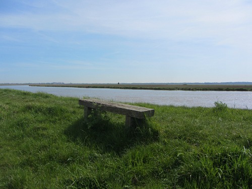 A solitary bench overlooking the river A solitary bench overlooking the river
