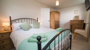 The bedroom in one of the Barton chalets