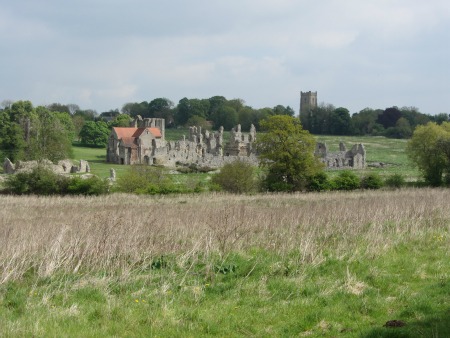 Distant view of Castle Acre Priory ruins
