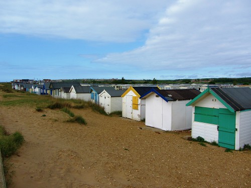 The beach huts behind the promenade at Heacham