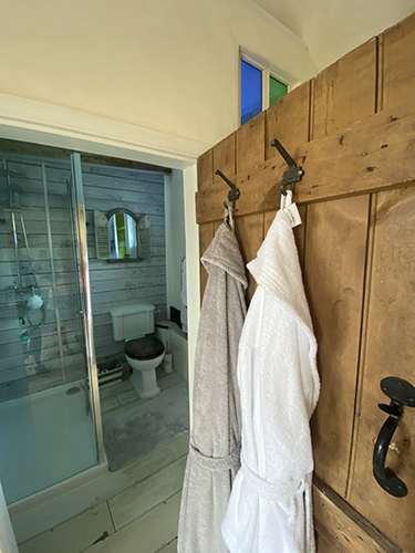 The bathroom with bathrobes for your own use The bathroom with bathrobes