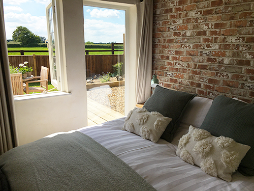 The bedroom with views over the paddock The bedroom with views over the paddock
