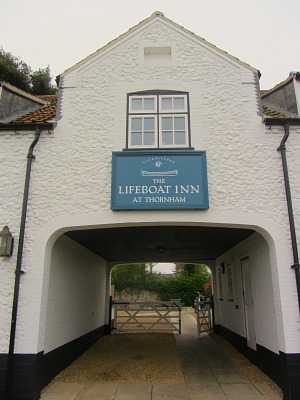 The original arch way at The Lifeboat Inn for horse drawn carriages The original arch way at The Lifeboat Inn for horse drawn carriages
