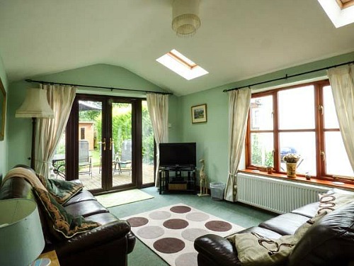 The sitting room at Kingsley Cottage, Norfolk Broads The sitting room at Kingsley Cottage, Norfolk Broads