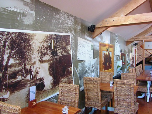 The restaurant with unique wallpaper depicting historic times at The Boathouse The restaurant with unique wallpaper depicting historic times at The Boathouse